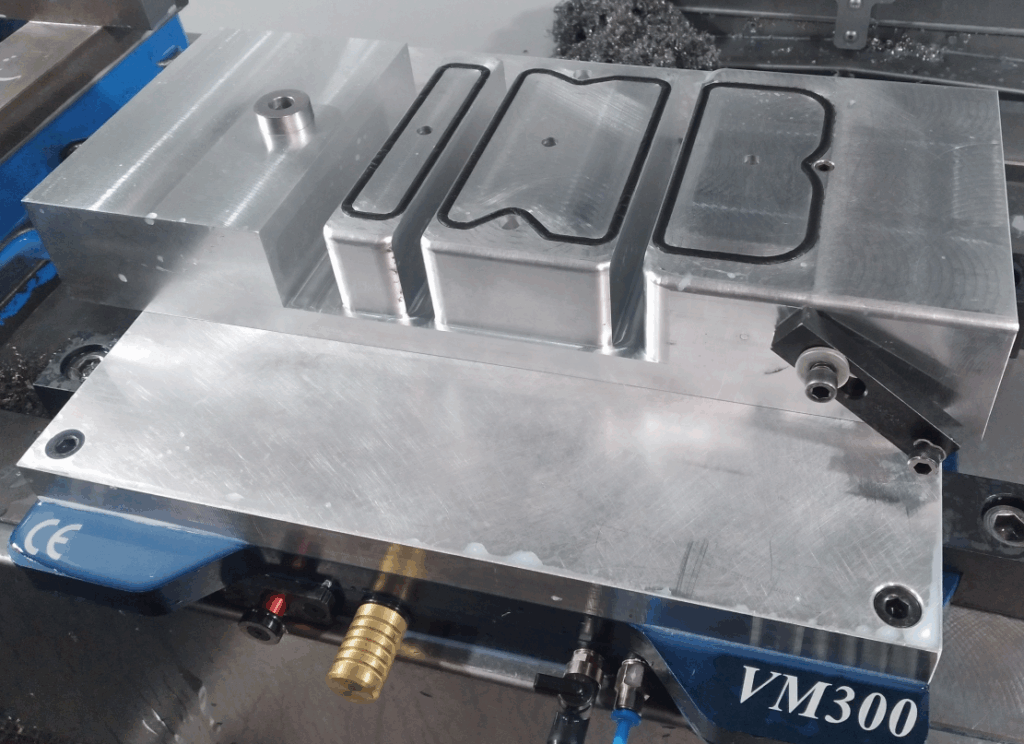 Custom vacuum fixture with Gaskets and vacuum ports for each vacuum surface.